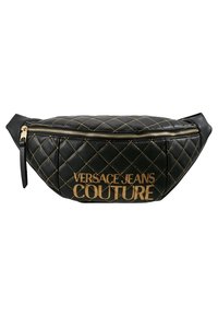 Black quilted leather fanny pack with golden hardware, featuring a large embossed logo and a top zipper closure. Compact and streamlined design.