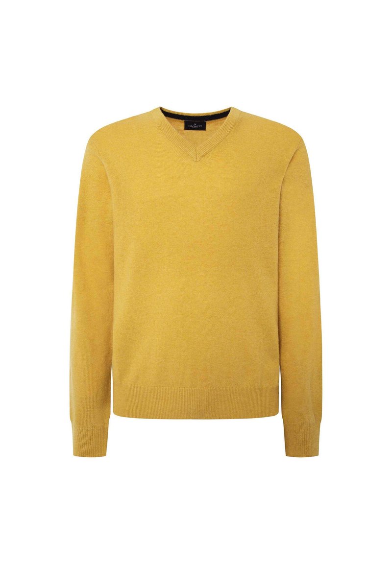 Pull à col V couleur moutarde, en tissu doux. Il présente des manches longues et des poignets et un ourlet côtelés pour un ajustement snug.