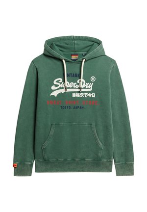 Sudadera verde de algodón, con un bolsillo frontal, cordones y estampado de texto: "Vintage SuperDry", con acentos en blanco y rojo.