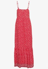 Robe maxi rouge à fleurs avec des bretelles fines, un corsage ajusté et une jupe évasée. Le tissu présente de petits motifs de fleurs blanches et roses.