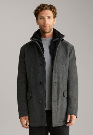 Charcoal gray, wool-blend coat with herringbone pattern, button closure, two front pockets, and a stand-up collar. Inner vest visible.