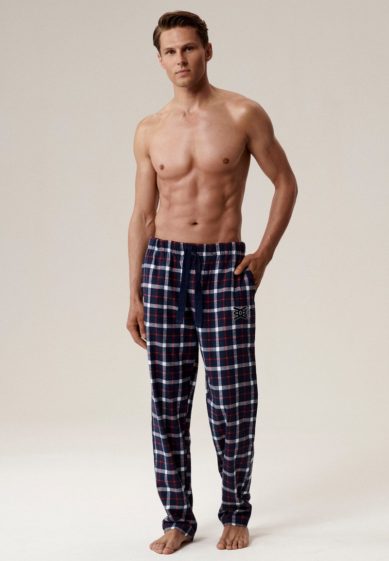 Granatowe piżama w kratę z elastycznym pasem i sznurkiem do regulacji, z boczną kieszenią z logo. Wykonane z miękkiego, lekkiego materiału.