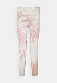 Legginsy z mieszanki bawełny o wzorze tie-dye w jasnoróżowym i beżowym kolorze, z wysokim stanem i dopasowanymi mankietami przy kostkach.