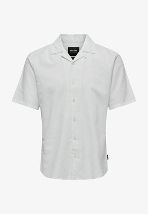 Korte mouwen witte shirt van lichtgewicht stof met een puntkraag, knoopsluiting en een relaxte pasvorm. Label zichtbaar aan de binnenkant van de kraag.