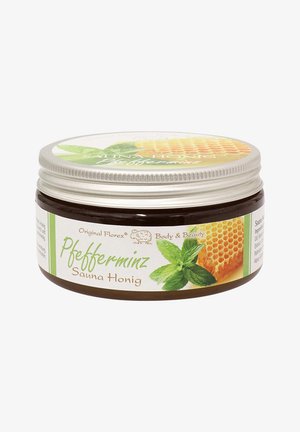 Braunes Glasgefäß mit silbernem Deckel, beschriftet mit "Pfefferminze Sauna Honig." Mit einem Design aus Minzblättern und Honigwaben in grünen und gelben Akzenten.