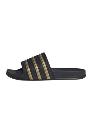 Sandalo slide nero con cinturino strutturato con tre strisce dorate metalliche e una soletta sagomata.