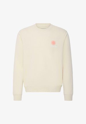 Sweat-shirt écru à col rond avec manches longues et petit graphique de soleil rose avec le texte "Sun Seeker" sur la poitrine gauche.