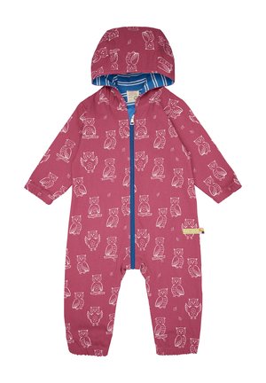 Rosa Latzhose für Kinder mit weißen Eulenmotiven. Mit einem blauen Reißverschluss und Kapuze, elastischen Bündchen und einem gestreiften Futter. Weicher Stoff.