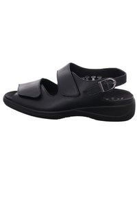 Black leather sandal featuring two adjustable straps, an open toe design, and a cushioned sole for comfort. Lightweight and flexible structure.