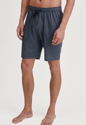 Marineblauwe shorts met een geometrisch wit patroon, een elastische tailleband en een trekkoord; lichtgewicht stof met een relaxte pasvorm.