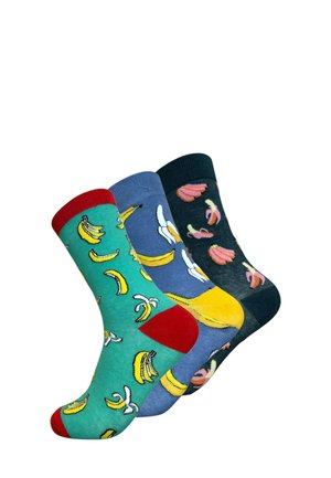 Drie paar katoenen sokken: groen met rode accenten en banaanpatronen, blauw met gele bananen, en donkerblauw met roze bananen.