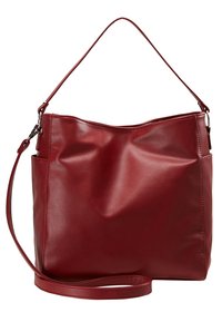 Sac en cuir rouge avec une surface douce, doté d'une seule bandoulière et d'un design lisse et non structuré. Poche latérale visible.