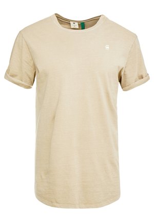 Beiges T-Shirt mit kurzem Ärmel und Rundhalsausschnitt, mit aufgerollten Bündchen und kleinem weißem Logo auf der linken Brust.