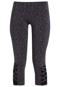 Ciemnoszare melanżowe legginsy damskie typu cropped z czarnymi krzyżującymi się wycięciami w dolnej części zewnętrznych łydki.