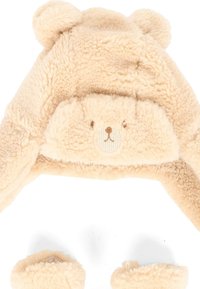 Cappello accogliente a tema orso beige realizzato in tessuto peluche, con piccole orecchie e un volto ricamato. Include guanti abbinati con una texture morbida.