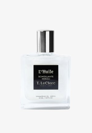 Heldere glazen fles van T. LeClerc L'Huile Scintillante Néroli glinsterende olie met zilverkleurige dop, inhoud 50 ml.