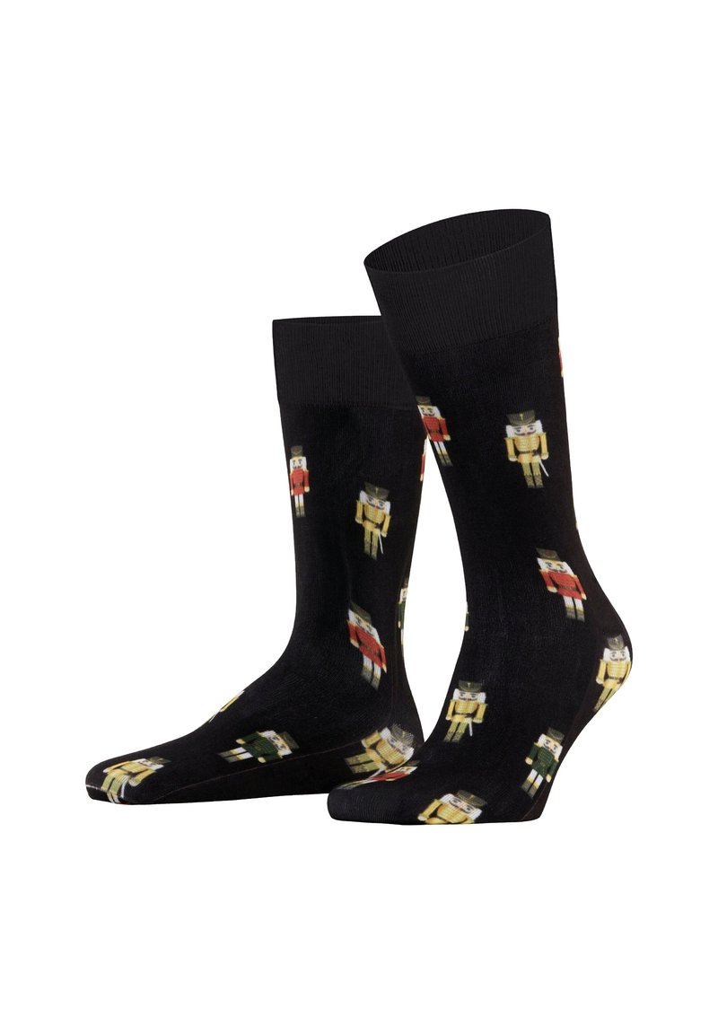 Czarne skarpetki z powtarzającym się motywem skrzata w kolorze czerwonym, żółtym i zielonym. Wykonane z gładkiego materiału i z prążkowanym ściągaczem dla większego komfortu.