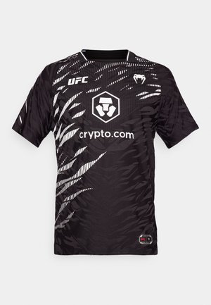 Black short-sleeve jersey featuring a textured pattern in white, UFC logo on the upper left, and branding at the center.