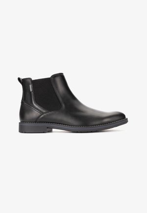 Stivale Chelsea in pelle nera con pannello laterale elastico, tirante sul tallone, suola cucita e tacco basso su sfondo bianco.