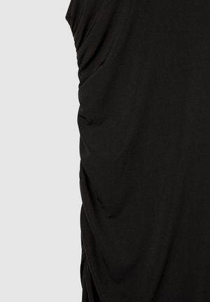 Top nero senza maniche realizzato in tessuto morbido, con texture arricciata su un lato e finitura liscia, dalla vestibilità comoda.