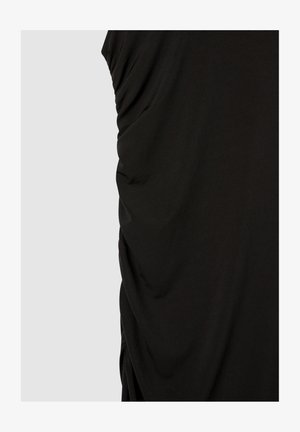 Top nero senza maniche realizzato in tessuto morbido, con texture arricciata su un lato e finitura liscia, dalla vestibilità comoda.