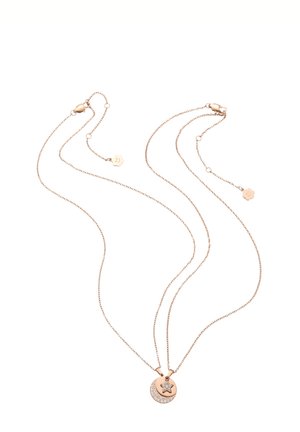 Two delicate rose gold chains with lobster clasps, each holding pendants shaped like a crescent moon with crystals and a crystal-studded star.