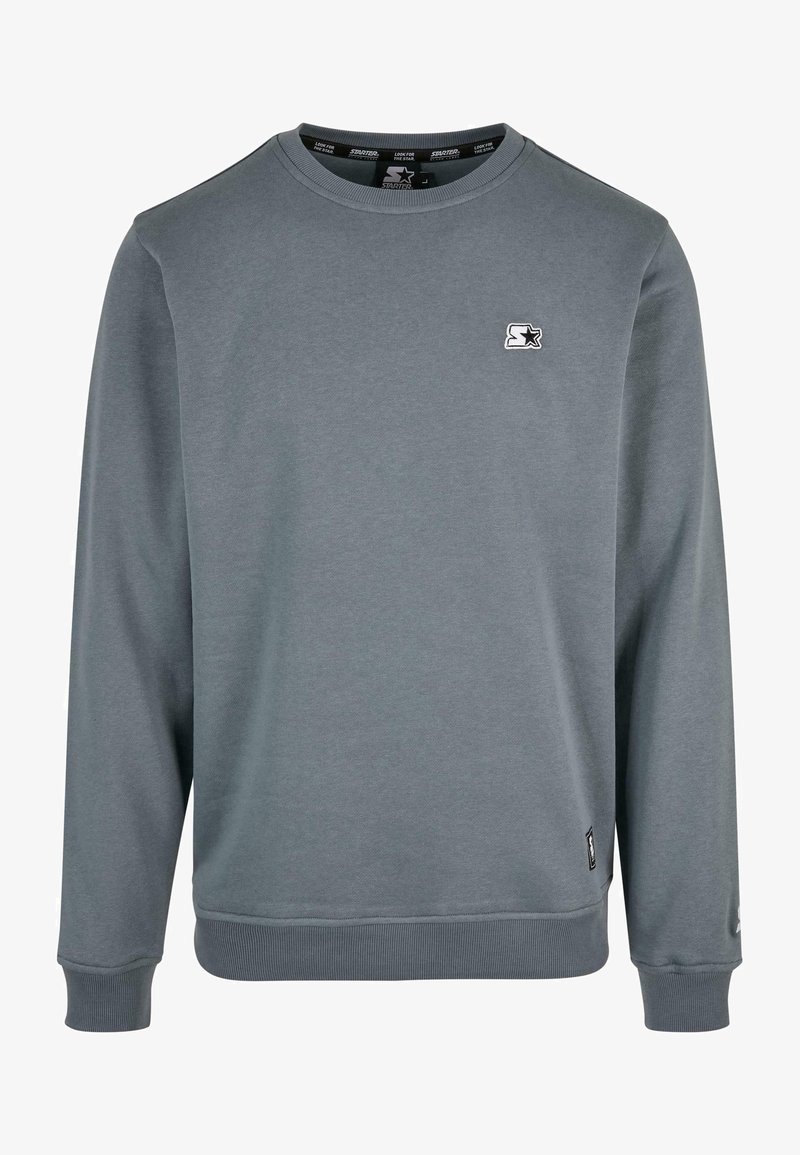 Grauem Rundhalsausschnitt-Sweatshirt aus weichem Material. Mit gerippten Bündchen und Saum sowie einem kleinen Logo-Akzent auf der Brust.