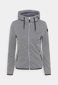 Giacca con cappuccio caratterizzata da un motivo geometrico in bianco e nero, con chiusura a zip, tasche laterali e tessuto testurizzato. Accenti blu navy sul cappuccio.