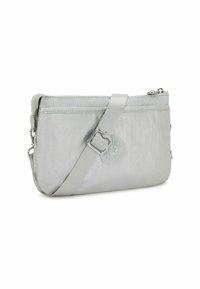 Light gray, soft-shell crossbody bag with a zipper closure, adjustable strap, and a round logo accent. Smooth texture with subtle sheen.