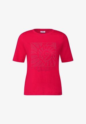 Camiseta de manga corta y cuello redondo en color rosa, con un estampado gráfico texturizado en brillantina plateada que lleva la palabra "SANTORINI" debajo.