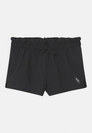 Sorte shorts med elastisk talje, rynket linning, snøre og lille elg-logo på nederste højre ben.