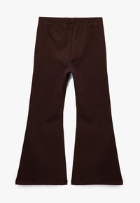 Bruna utsvängda leggings med elastisk midja, tillverkade av mjukt, stretchigt tyg; slät yta utan synliga mönster eller dekorationer.