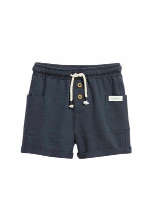 Marineblaue Baumwollshorts mit elastischem Bund, weißem Kordelzug, zwei Fronttaschen, Knopfakzenten und einem kleinen "newbie"-Label auf der rechten Tasche.