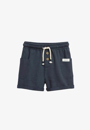 Marineblaue Baumwollshorts mit elastischem Bund, weißem Kordelzug, zwei Fronttaschen, Knopfakzenten und einem kleinen "newbie"-Label auf der rechten Tasche.