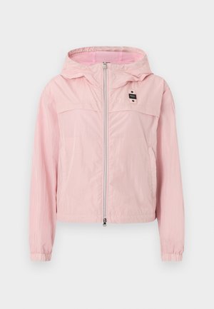 Light pink hooded windbreaker jacket with front zipper, elastic cuffs, mesh lining in hood, and a small black label on the chest.