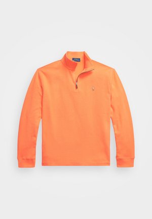 Orange zip-up pullover sweatshirt made of cotton blend material, featuring a mock collar, long sleeves, and a small logo on the chest.