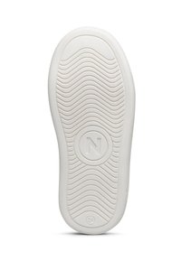 Suola di una sneaker con trame ondulate, logo circolare con "N" al centro e materiale in gomma bianca.