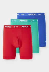 Heren boxershorts, drie-pack in rood, groen en blauw. Gemaakt van zachte stof, met elastische taillebanden met "Nike" branding.