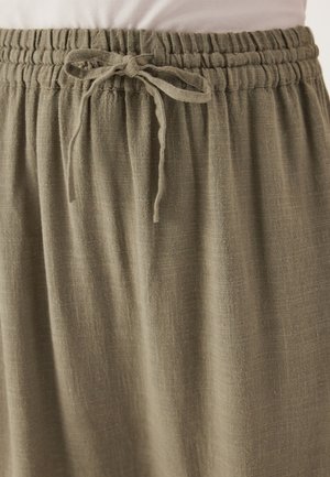 Olive green, lightweight skirt with an elastic waistband and drawstring. Fabric has a subtle texture, falling in soft drapes.