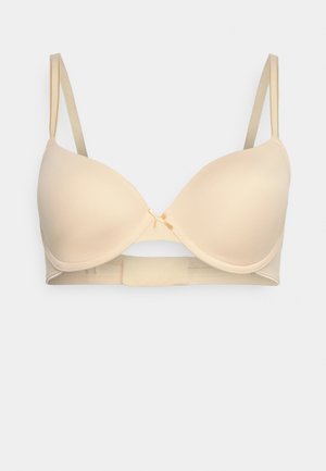 Beige pehmustettu rintaliivi, jossa on sileät kupit, säädettävät olkaimet, hakasen ja silmukan suljenta sekä pieni koristeellinen nauha keskiosassa.