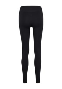 Schwarze gerippte Leggings mit einem nahtlosen Bund, die eine enge Passform und eine glatte Textur aufweisen, ideal für Sportbekleidung.