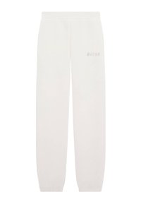 Pantalones de chándal blancos de tejido suave, con una cintura y puños elásticos, y un sutil logo "GUESS" en letras metálicas en el costado.