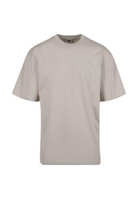 Beige bomulds T-shirt med rund hals, korte ærmer og en afslappet pasform. Glat tekstur uden synlige mønstre eller accenter.