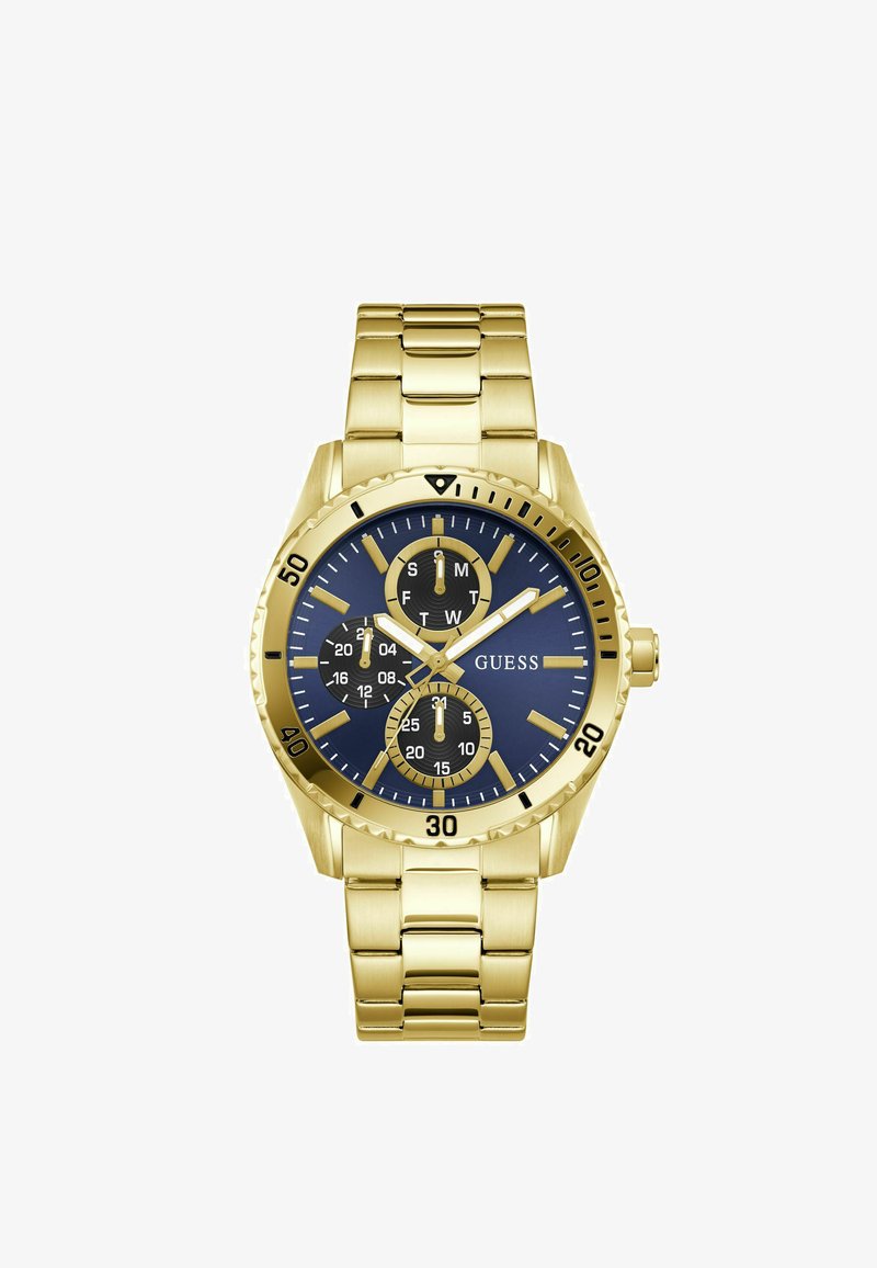 Χρυσό μεταλλικό ρολόι χειρός με μπλε καντράν, τρεις μαύροι υποκάρδιες για ημέρα, ημερομηνία και 24ωρη ώρα, καθώς και χρυσά σημάδια ώρας και δείκτες.