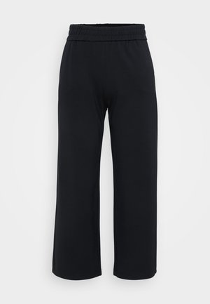 Pantalones anchos negros con una cinturilla elástica, hechos de una tela suave. Presentan una textura lisa y un ajuste suelto y cómodo.