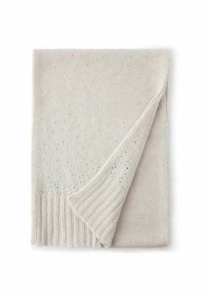 Stickad sjal i ljus beige med silverdekorationer. Har en ribbad kant och ett vikt hörn som visar en texturerad yta.