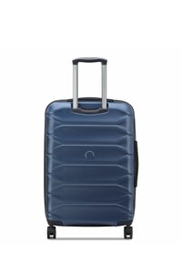 Hartschalen-Handgepäckskoffer in Marineblau, mit gerippter Textur, ausziehbarem Griff und vier Rädern für einfache Mobilität.