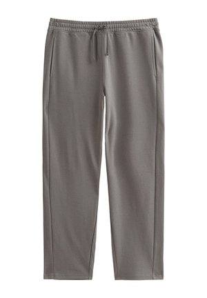 Pantaloni della tuta grigi realizzati in tessuto morbido, con vita elasticizzata e cordino, tasche laterali e gambe affusolate.