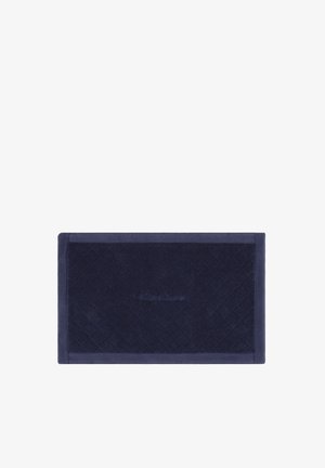 Serviette rectangulaire bleu marine avec un motif discret de losanges et une bordure, ornée d'un logo Ralph Lauren embossé au centre.