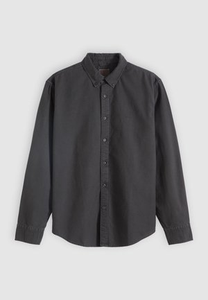 Camicia nera a maniche lunghe con bottoni e colletto a risvolto, realizzata in tessuto morbido e strutturato, con bottoni frontali e polsini con bottoni.